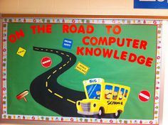 a bulletin board with a school bus on the road to computer knollge in front of it