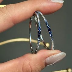 14KT white gold multi-tonal blue sapphires + diamond prong-set diamond hoop earrings. Matching bracelet also available. Lovely, ombre blue sapphires!! Lively diamonds and sapphires! Pictures do not do these earrings justice! Length: 34mm Thickness: 1mm~ 2.5mm tapers by size of stone Weight: 5.6 Grams Stamped 14K 1 3/4 Multi Sapphires Carat total weight 1/3 CT natural, round diamonds Formal Blue Hoop Earrings With Prong Setting, Blue Round Hoop Earrings For Formal Occasions, Formal Blue Round Hoop Earrings, Blue Hoop Earrings With Prong Setting, Blue Round Hoop Earrings For Anniversary, Elegant Sapphire Hoop Jewelry, Blue Sterling Silver Hoop Jewelry, Blue Hoop Sterling Silver Jewelry, Sapphire Hoop Jewelry For Anniversary