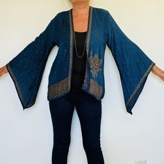 A Beautiful Boho Hippie Chic Kimono Jacket. Perfect for Holidays,Parties,Weddings and Celebrations as a Cover Up. Handmade in India from a Vintage Sari ,so completely unique and sustainable. The Fabric is a Gorgeous and Flattering Teal Silk Jacquard. The Exquisite Embellishment features a Paisley Design with 1000's of Glittering Sequins and Crystals. The Style is mid length ,with Kimono style sleeves. The size will fit and flatter sizes  S M L    UK 8 to 14 , US 4 to 10.   EU 36 to 42. The lengt Long Sleeve Party Outerwear With Intricate Embroidery, Bohemian Fitted Cardigan For Party, Traditional Embroidered Outerwear For Parties, Fitted Long Sleeve Cardigan For Festival, Festive Long Sleeve Sequin Outerwear, Bohemian Outerwear With Embroidered Kimono Sleeves, Festival Long Sleeve Kimono With Floral Embroidery, Embroidered Fall Kimono With Kimono Sleeves, Bohemian Long Sleeve Kimono With Intricate Embroidery