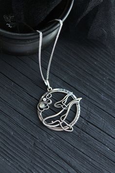 ITEM DESCRIPTION: The size of the pendant - H 4 х W 4 cm (1 1/2 x 1 1/2 inches), weight 7g. Jewelry will come to you in a gift box - ready for gifting. I made this motherhood jewelry of sterling silver, labradorite, and rainbow moonstone. This unique necklace looks so touching. This is a story of the relationship between parents and children. It is not easy. But this is important for each of us. I hope this wire wrapped necklace will be a wonderful gift for someone whole you love: for your mothe Silver Medallion Jewelry Gift For Mom, Silver Medallion Jewelry As Gift For Mom, Spiritual Pendant Jewelry For Mother's Day, White Gold Jewelry With Large Pendant As Gift, Unique Jewelry For Mother's Day Gift, Unique Jewelry As Mother's Day Gift, Unique Jewelry Gift For Mother's Day, Hand Forged Sterling Silver Jewelry For Gift, Hand Forged Sterling Silver Jewelry Gift