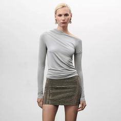 Discover Elegance and Comfort in One Embrace your day with confidence and style with our Grey Asymmetrical Collar Ruched Tee. Designed for the modern woman, this top merges classic elegance with contemporary design, making it a versatile addition to your wardrobe. Perfect for office wear or a casual day out, this tee is sure to make a statement wherever you go. Product Features Our Grey Ruched Tee comes with an array of features designed to enhance your style and comfort. It's crafted from a high-quality blend of polyester and spandex, offering a slight stretch for a perfect fit. The unique asymmetrical collar adds a touch of sophistication, while the full-length sleeves provide an elegant silhouette. The solid color pattern and classic style theme ensure it pairs seamlessly with your favo Casual Meeting, Asymmetrical Collar, Middle Aged Women, Office Wear, Classic Elegance, Modern Woman, Product Features, The Modern, Contemporary Design