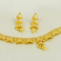 Adorn yourself with this elegant gold necklace, featuring a delicate chain and a stunning, handcrafted pendant. Its versatile design makes it a perfect accessory for both casual and formal looks, adding a subtle touch of glamour to your ensemble. 22kt yellow gold handmade chain necklace jewelry from Rajasthan India. Weight- 14.95 grams approx. Metal- yellow gold real gold. Metal purity- 22 Karat. Brand- StarLikesGold Max Length - Necklace 21.5 centimeter approx. Earrings - 3.5 centimeter approx 22 Karat Gold Jewelry Necklaces, New Necklace Designs, Elegant Gold Necklace, 22 Karat Gold Jewelry, Gold Bracelet Simple, Gold Jewellry, Jewelry Set Design, Handmade Chain, Length Necklace