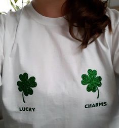 a woman wearing a lucky charm shirt with shamrocks on it