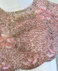 For Sale on 1stDibs - Beautiful vintage MARY MCFADDEN pink beaded and sequined collar ! Features thousands of hand-sewn sequins and beads throughout the entire piece. Hook-and-eye Pink Sequin Fabric With Pearl Embroidery For Party, Embellished Pink Sequin Fabric For Evening, Pink Embellished Sequin Fabric For Evening, Evening Pink Embellished Sequin Fabric, Pink Embellished Sequin Fabric, Glamorous Style, Pink Beaded Sequin Fabric For Party, Elegant Pink Embellished Sequin Fabric, Elegant Pink Sequin Fabric For Celebration, Mary Mcfadden