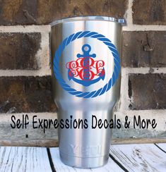 a stainless steel tumbler with the words self expressions details and more on it, sitting in front of a brick wall