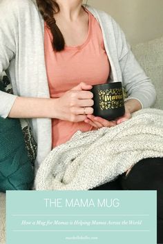 a woman sitting on a couch holding a coffee mug