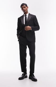 A skinny fit enhances the contemporary appeal of this tuxedo jacket classically detailed with contrast lapels. 30 1/2" length (size 42r) One-button closure Notched lapels Nonfunctional four-button cuffs Chest welt pocket; front flap pockets Partially lined 77% polyester, 17% viscose, 6% elastane Machine wash, line dry Imported Elegant Black Double Breasted Suit With Hidden Buttons, Evening Suits With Notch Lapel And Pressed Crease, Tailored Double Breasted Tuxedo With Lapel Collar, Luxury Tuxedo With Hidden Button Closure For Black-tie Events, Timeless Evening Tuxedo With Lapel Collar, Timeless Evening Suits With Lapel Collar, Black Tuxedo With Notch Lapel For Evening, Black Notch Lapel Tuxedo For Evening, Black Tuxedo With Lapel Collar