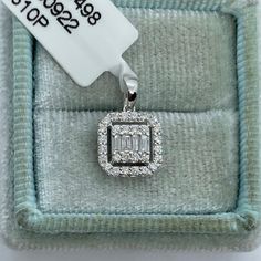 Beautiful Emerald Cut Diamond Pendant With Halo.  Set with sparkling Cluster of Baguette and Round Diamonds.  This dainty pendant is perfect to wear for any occasion. Excellent craftsmanship, lays nicely on the neck, won't flip around.  Wear this small pretty necklace on its own or layer with other necklaces. Pendant measures about 8.8mm.  Simple and Classy pendant.  14K White gold strong link chain shown in pictures available for purchase.   Genuine Diamonds baguette and Round brilliant cut diamonds  Total weight: 0.33 carats  Clarity: SI/I Color: H All white and shiny diamonds, no cloudy or yellowish stones  Solid 14K White Gold Comes with gift box #2410pj * We have been in the wholesale Jewelry business for over 30 years serving the community at the same location. All diamonds we use ar Classy Pendant, Emerald Cut Halo, Pretty Necklace, Necklaces Pendant, Dainty Pendant, Emerald Cut Diamond, Halo Pendant, Pretty Necklaces, Necklace Dainty