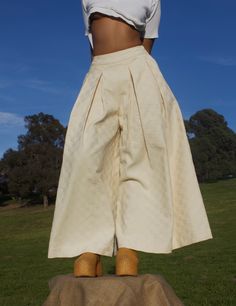 .. A forever wardrobe staple, the Khadijah Pant is a mid-high waisted wide leg pant. With double pleating cascading down the front of each pant leg, this voluminous detail takes on the illusion of a maxi skirt. The smooth waistband on the front fades into an elasticated one on the back. This detail is intended for a comfortable wear, while cinching your waist to ensure the proper fit. .. Mid-high waisted, wide leg pant .. Double pleating on each pant leg .. 2" smooth waistband on front, elastica High Waisted Wide Leg Pants, Wide Leg Pant, Dress Hats, Crop Blouse, Hat Shop, British Indian, Mozambique, Cropped Pants, Wardrobe Staples