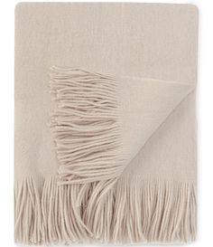 a blanket with fringes on the bottom and one side folded up in beige color