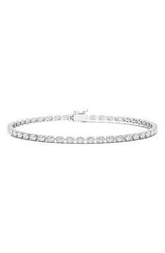 Oval-cut lab-grown diamonds are prong-set along this distinctive tennis bracelet. Total lab-grown diamond weight: 6.20ct. Color: D-F Clarity: EX-VS 14k gold/lab-grown diamond Made in the USA >Diamond Guide Oval Link Diamond Tennis Bracelet With Diamond Accents, Oval Link Diamond Tennis Bracelet With Accents, Diamond Tennis Bracelet With Oval Link And Accents, White Gold Oval Tennis Bracelet With Prong Setting, Oval White Gold Tennis Bracelet With Prong Setting, Oval Brilliant Cut Diamond Tennis Bracelet, Oval Diamond White Tennis Bracelet, White Gold Diamond Tennis Bracelet With Oval Links, Oval Tennis Bracelet With Prong Setting For Anniversary