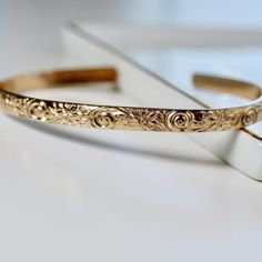 This thick gold filled floral open bangle is perfect for wearing alone or mixing and matching with your other cuffs.This open bangle was hand fabricated in Melt'm Jewelry Studio in CaliforniaNow we are offering engraving inside to our bracelets! DETAILS ABOUT THE BRACELET*** Gold filled floral bracelet is 5.2mm wide and 1.8mm thickness. Please write your preferred message to engrave into your bracelet in the CUSTOMIZE IT box below. Bracelet Flowers, Message Bracelet, Topaz Jewelry, Floral Bracelet, Tourmaline Jewelry, Open Bangle, Aquamarine Jewelry, Garnet Jewelry, Gold Bracelet Cuff