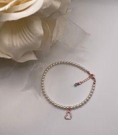 ~ This anklet is an accent to her beautiful princess bridal gown and shoes. The anklet features 4 mm Swarovski crystal pearls and a Cubic Zirconia framed horseshoe. Each anklet is hand-made and made to order ~Please specify white or Ivory Swarovski crystal pearl  ~Rose Gold lobster clasp....comes with 1 inch rose gold extender with blue Swarovski Crystal    ~ Comes with something blue card and may personalize card ~Please let me know the anklet size. To measure for the anklet sizes- wrap a ribbon or string around your ankle, mark it with a pen, measure it and add 1/2" for comfort-loose fit or exact fit  ~Each anklet will arrive in a box tied with a ribbon perfect for gift giving and dust cover pouch ~Please read our policies for information on international shipping, returns, and exchanges White Heart-shaped Beaded Bracelets For Wedding, White Pearl Bracelet With Heart Charm For Wedding, Adjustable Beaded Bracelets With Heart Charm For Wedding, White Pearl Wedding Bracelet With Heart Charm, Heart-shaped Beaded Bracelets For Wedding, White Heart-shaped Pearl Bracelet For Wedding, White Pearl Bracelet For Wedding And Valentine's Day, White Pearl Wedding Bracelet For Valentine's Day, White Pearl Wedding Bracelet