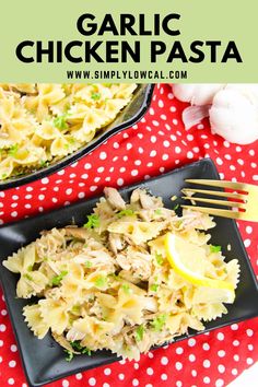 garlic chicken pasta on a black plate with a red and white polka dot tablecloth