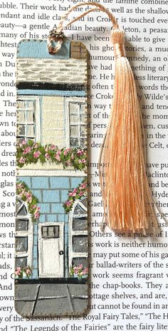 a bookmark with a tassel hanging from it