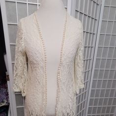 Long Lace Cream Colored Duster Jacket Or Swimsuit Cover Up In Size M By Mauve. About 40 Inches Long From Back Of Neck. Flared 3/4 Sleeves And Scalloped Like Edging. Never Worn. Spring Party Outerwear With Lace Trim, Fitted Cardigan For Brunch, Summer Long Sleeve Outerwear With Lace Trim, Elegant White Outerwear With 3/4 Sleeves, Fitted Open Front Outerwear For Brunch, White Fitted Outerwear With 3/4 Sleeves, Lace Duster, Duster Jacket, Swimsuit Cover