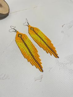 Beautiful yellow fringed earrings.  Made of Czech beads length 4.5 inches (11.5 cm) Width 1 inch (2.5 cm) Hypoallergenic clasp. If you want these earrings in a different color, write to me and I will be happy to make them for you. >Back to my shop: https://www.etsy.com/shop/jewelrybylarisa?ref=seller-platform-mcnav Cheap Yellow Beaded Earrings, Cheap Yellow Beaded Earrings For Summer, Yellow Dangle Jewelry With Tassels, Bohemian Yellow Dangle Chandelier Earrings, Yellow Handmade Tassel Earrings, Yellow Fringe Tassel Drop Earrings, Yellow Fringe Tassel Earrings, Yellow Fringe Jewelry Gift, Yellow Fringe Jewelry For Gift