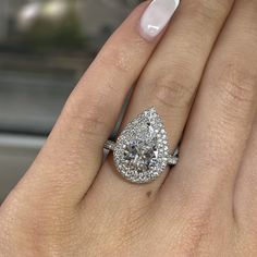 This is a custom setting that includes the center stone and is available to ship for Next Business Day Delivery!! We only have 1 in stock!!

 Featuring 1.34 Carats of Natural Earth Mined Diamonds in the setting and a 3.09 carat Certified Lab Grown Diamond, D in color, and I1 in Clarity as the center stone. Luxury Pear-shaped Diamond Ring With Pavé Setting, Luxury Gia Certified Pear-shaped Wedding Ring, Elegant Gia Certified Teardrop Diamond Ring, Gia Certified Teardrop Diamond Ring For Formal Occasions, Pear-shaped Moissanite Wedding Rings With Vvs Clarity, Formal Gia Certified Teardrop Diamond Ring, Gia Certified Teardrop Diamond White Diamond Ring, Luxury Teardrop Diamond Ring With Center Stone, Elegant Gia Certified Pear-shaped Diamond Ring