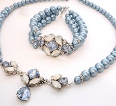 Elegant Vintage style Bridal Necklace. Made with high-quality Swarovski crystals in light blue and white opal, finished with a single strand pearls. .The combination of crystals and pearls and different color stones makes this handmade set very unique and elegant. All designed and made by me in my SimplyChic studio. The length of the necklace is 17 inches plus a 3-inch extension chain for flexible length. The bracelet is made custom to fit your wrist perfectly. Please leave me a note at checkout Blue Wedding Accessories, Victorian Wedding Jewelry, Crystal Barrette, Crystal Hair Clip, Vintage Fan, Blue Pearls, Crystal Hair Clips, Rhinestone Hair Pin, Something Blue Wedding