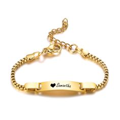 a gold bracelet with the name and heart engraved on it