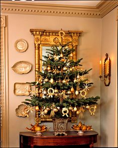 a decorated christmas tree in a corner of a room