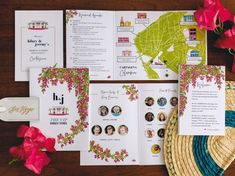 the wedding stationery is laid out on top of the table with flowers and cards