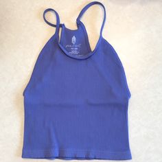 Nwot, No Outside Logo, Inside Logo Fading Due To Misprint. Fit: Slim. Scoop Neck Silhouette Features: Cropped Design, Seamless Rib Fabrication, Racerback Design, Entry-Level Compression Why We <3 It: So Effortless With Or Without A Bra, This Tank Will Be Your Go-To From The Studio To The Street. Blue Fitted Seamless Halter Top, Blue Seamless Fitted Halter Top, Blue Racerback Crop Top Casual, Blue Racerback Halter Top, Casual Blue Racerback Crop Top, Blue Stretch Tops For Vacation, Trendy Blue Racerback Top, Blue Tank Crop Top For The Beach, Blue Tank Crop Top For Beach