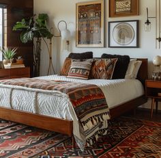 a large bed sitting in a bedroom on top of a rug