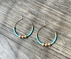 ~ Details ~ These boho style earrings are great for everyday, work, casual or just for a fun pop of color !  Genuine matte gold hematite, turquoise and matte gold colored glass seed beads. 1.25" inches in diameter in matte gold lightweight hoops (lead and nickel free plating over brass) ~ listing is for 1 pair of earrings ~ Join me on Instagram: www.instagram.com/therubyleo Join me on Facebook: www.facebook.com/therubyleo Join me on Pinterest: www.pinterest.com/therubyleo Nickel Free Bohemian Beaded Earrings For Everyday, Nickel Free Bohemian Beaded Earrings, Nickel-free Bohemian Beaded Earrings, Bohemian Nickel Free Beaded Earrings For Everyday, Everyday Bohemian Nickel-free Beaded Earrings, Bohemian Small Hoop Beaded Earrings Nickel Free, Bohemian Nickel-free Small Hoop Beaded Earrings, Nickel-free Bohemian Beaded Hoop Earrings, Bohemian Earrings With Spacer Beads For Festivals