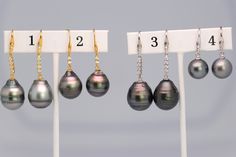 Tahitian Pearl Drop Earrings 925 Sterling Silver Displayed optionally with Yellow Gold Plating and cubic zirconia detail. Please pick the set you would like from the drop down bar and we will ship you the exact pair of earrings pictured. Set #1-12.2mm Set #2-15.3mm Set #3-15.8mm Set #4-10.4mm ------------------------------------------------------------------------- FREE shipping in the USA! We ship in 1 to 3 days from Hawaii by First Class Airmail. Shipping to the USA usually takes 3 to 5 days. Elegant Jewelry With Diamond Markers, Elegant Earrings With Diamond Markers As Gift, Elegant Diamond Marker Earrings For Gift, Elegant Anniversary Jewelry With Diamond Markers, Elegant Jewelry With Diamond Markers For Formal Occasions, Elegant Formal Jewelry With Diamond Markers, Silver Display, Drop Pearl Earrings, Tahitian Pearl Earrings