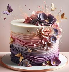 there is a multi layer cake with flowers on it and butterflies flying around the cake