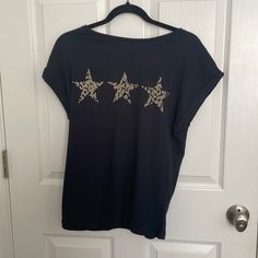 From A Smoke-Free Household Black Short Sleeve Tops With Star Print, Black Star Print Casual T-shirt, Black Casual T-shirt With Star Print, Casual Black Top With Star Patch, Black Crew Neck Top With Star Patch, Casual Black Top With Star Print, Relaxed Fit Short Sleeve Top With Star Print, Black Crew Neck T-shirt With Star Patch, Relaxed Fit Graphic Tee With Star Print