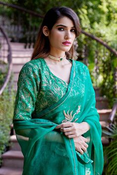 Emerald green silk organza saree with spring, zardozi placement embroidery. Comes with a blouse piece.
Component: 2
Pattern: Embroidery, Woven
Type Of Work: Spring, zardozi
Fabric: Saree - Silk Organza, Blouse - Brocade
Color: Green
Other Details: 
Border embroidered saree
Placement pattern
Note: Stitched blouse shown in the images is not for sale
Occasion: Reception - Aza Fashions Green Anarkali Set With Unstitched Blouse For Designer Events, Green Anarkali Set For Designer Wear, Green Resham Embroidered Cotton Silk Blouse Piece, Green Organza Blouse Piece With Zari Work, Traditional Green Organza Blouse Piece, Designer Green Organza Saree, Green Tissue Silk Choli With Unstitched Blouse, Green Cotton Silk Lehenga With Unstitched Blouse, Green Anarkali Style Organza Pre-draped Saree