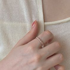 a woman's hand with a ring on it