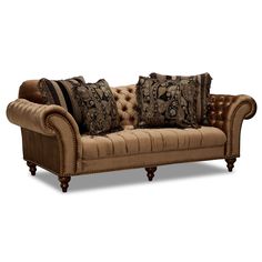 a brown couch with pillows on top of it