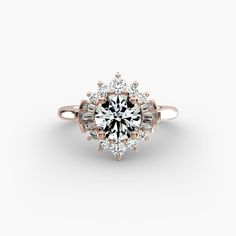 an engagement ring with diamonds on the side and a center stone surrounded by smaller stones