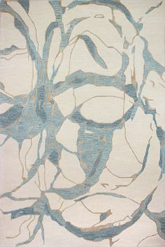 a blue and white area rug with an abstract design on the bottom half of it