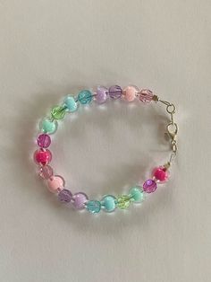 🎀 Add a pop of color to your look with the Pastel Candy Dreams Bracelet 🎀 I make all my jewelry handmade and from recycled beads. This bracelet is adjustable and customizable. Please message me with any special requests and I will make them happen. Adjustable Pastel Jewelry With Letter Beads, Pastel Colorful Beads Bracelets As Gift, Pastel Colorful Beads Bracelet As Gift, Pastel Bracelets With Colorful Beads For Gift, Pastel Beaded Bracelets Gift, Pastel Beaded Bracelets For Gift, Adjustable Pastel Bracelets With Round Beads, Adjustable Pastel Beaded Bracelets As Gift, Adjustable Pastel Beaded Jewelry