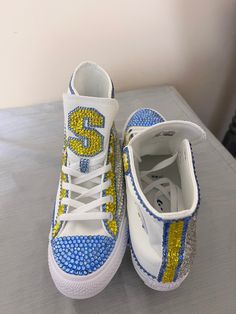 These shoes are made to order. They are hi-top converse tennis shoes. All teams, college and professional can be created. Various logos are available for your professional and/or college team. I also do sorority shoes! Please message me about the team of your choice or style! Wedding shoes are also available! Sorority Shoes, Converse Wedding, Hi Top Converse, College Tennis, Converse Tennis Shoes, Rhinestone Outfit, Barbie Doll Clothing Patterns, Shoes Converse, Bling Shoes