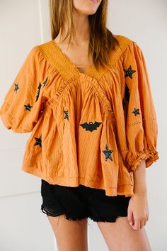 Add a touch of spookiness to your wardrobe with this stylish and fun orange top! Featuring black sequin bat patches, this top is perfect for Halloween or any day you're feeling a little batty. Pairs well with jeans or a skirt for a versatile and unique look! All orders are currently shipping within 14 business days. To receive item quicker, expedited shipping is available at checkout. **ALL HALLOWEEN ORDERS MUST BE PLACED WITH EXPEDITED SHIPPING TO GUARANTEE DELIVERY BY OCT. 31 IF PLACED AFTER O Orange Top, Oct 31, Black Sequins, Bat, Sequin, Skirt, Orange, Wardrobe, Halloween