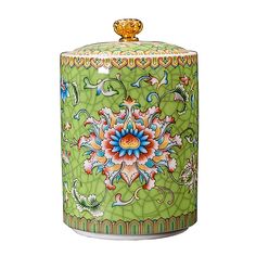 a green vase with colorful designs on it