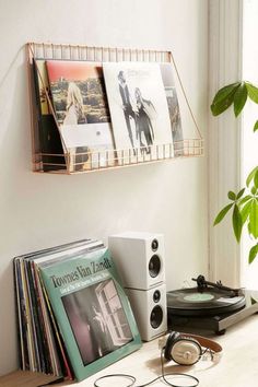 there is a record player and some records on the table