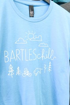 Exclusively at Moxie! BARTLESchill tees in multiple colors and multiple sizes.   If you don't see it on the website give us a call. 📞 918.87M.OXIE⁠ 📦 WE SHIP!⁠⁠ Moxie on Second | Bartlesville, Oklahoma⁠ Unisex Tshirt