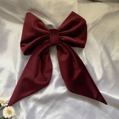 Add a touch of charm and sophistication to your hairstyle with this elegant heavier weight clip on hair bow in a burgundy red velvet. This large adult oversize hair bow is the perfect fashion accessory to effortlessly elevate your look for any occasion. Handcrafted with care, this handmade fabric hair bow clip adds a touch of classic glamour, sophistication and style to your outfit, whether you're heading to a special event, wedding or simply want to add a chic flair to your everyday look. Stand Red Hair Bows Aesthetic, Red Bow Hair Clip, Red Bow In Hair, 2025 Wishlist, Bridesmaid Fascinator, Bow Wedding Hair, Red Bow Hair, University Room, Hair Birthday