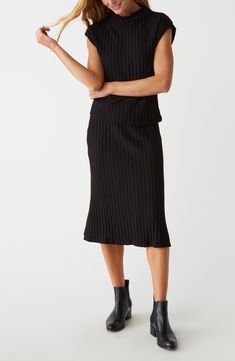 Every closet craves this versatile midi skirt shaped by wide ribbing for a soft look and feel. 30 1/2" length (size Small) Elastic waist 61% cotton, 37% viscose, 2% spandex Hand wash, dry flat Made in the USA Spring Midi Ribbed Skirt, Chic Ribbed Long Skirt, Chic Long Ribbed Skirt, Elegant Ribbed Midi Skirt, Ribbed Stretch Midi Skirt, Spring Ribbed Midi Skirt, Relaxed Ribbed Midi Skirt, Chic Ribbed Midi-length Bottoms, Chic Ribbed Midi Skirt