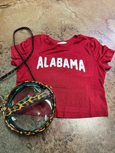 red alabama crimson tide t-shirt Collegiate Tops With Letter Embroidery For Game Day, Casual Letter Print T-shirt For Tailgating, Collegiate Letter Embroidery Top For Game Day, Team-colored Tops With Embroidered Graphics For Fans, Cotton Tops With Embroidered Graphics For Sports Events, Collegiate Tops With Embroidered Graphics For Game Day, Varsity Tops With Embroidered Graphics For Game Day, Collegiate Red Summer Tops, Varsity Style Top With Embroidered Graphics For Fan Gear