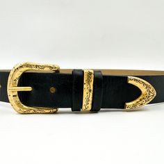 Upgrade your style with the Leyah black Italian leather belt. Made in California, this belt features a matte gold engraved buckle set for a touch of elegance and uniqueness. Details: Black Italian leather Matte gold buckle set Source in Italy Made in California Belts Aesthetic, Gold Buckle Belt, Chain Belts, Gold Belts, Gold Engraving, Black Leather Belt, Leather Cuffs, Small Handbags, Small Leather Goods