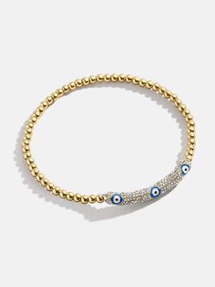 Keep bad vibes astray with the Harlow Pisa Bracelet - Evil Eye. Its chic gold design and positive evil eye detailing makes this the perfect everyday jewelry essential that benefits your life and your style. Easily slide this bracelet on and off — its stretch fit ensures easy wearing. Trendy Gold Evil Eye Bracelet, Trendy Gold Bracelets With Evil Eye, Spiritual Beads, Eye Details, Bad Vibes, Jewelry Essentials, Prime Time, Eye Bracelet, Evil Eye Bracelet