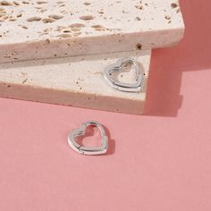 A simple pair of heart shaped huggie hoop earrings that any teen girl would love to receive as a special birthday present or valentines day gift. She will love the snug fit of this simple huggie, crafted from a 925 sterling silver, this pair of huggies are both safe and comfortable for young girls with sensitive ears. Featuring a hinged closure for more security, these earrings will surely become her go to pair with all of her outfits. Gift box included with purchase. Age Group: Sweet for Babies, Toddlers or Little Girls; Safe for Sensitive Ears 925 Sterling Silver Huggie Size: 11mm x 11mm Metal Stamp: 925 Gift Box Included Cheap Huggie Hoop Earrings For Valentine's Day, Cheap Huggie Heart Earrings For Pierced Ears, Cheap Heart-shaped Huggie Earrings, Cheap Huggie Heart Earrings, Cheap Huggie Heart Earrings For Valentine's Day, Cheap Heart-shaped Huggie Earrings For Valentine's Day, Cheap Nickel-free Heart-shaped Hoop Earrings, Affordable Huggie Heart Earrings As A Gift, Cheap Pink Huggie Earrings Gift