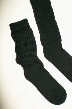 Slouchy knee high socks in a cotton/nylon blend. Thick ribbed cuff and a slim, fitted foot. Made in the USA. Available in black, heather grey, lavender, and red. Fitted Mid-calf Solid Color Socks, Warm Fitted Knee-high Socks, Black Stretch Cotton Knee-high Socks, Comfortable Fitted Knee-high Socks, Thick Casual Mid-calf Socks, Black Cotton Knee-high Socks For Fall, Classic Solid Winter Socks, Warm Fitted Cozy Socks, Warm Cozy Fitted Socks